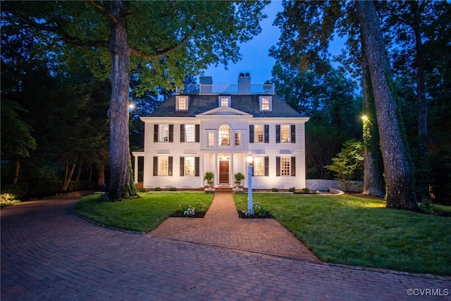 99 Walnut Hills Dr, Williamsburg, VA 23185 - colonial-style house featuring a chimney and a front yard