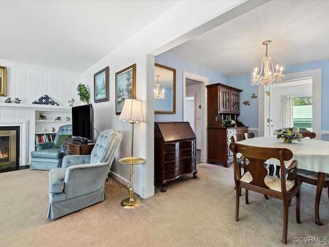 5913 Ridge Rd, Henrico, VA 23227 - dining room featuring a chandelier, light carpet, and a fireplace with flush hearth