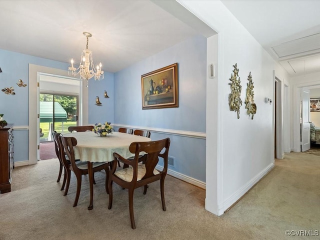 5913 Ridge Rd, Henrico, VA 23227 - dining space with light carpet, attic access, and a chandelier