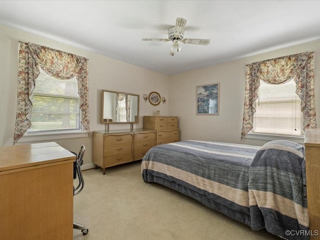 5913 Ridge Rd, Henrico, VA 23227 - bedroom featuring multiple windows, light colored carpet, and a ceiling fan