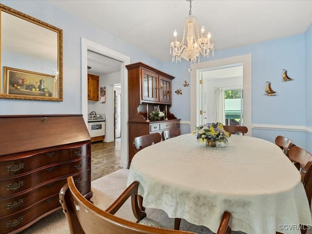 5913 Ridge Rd, Henrico, VA 23227 - dining room with a chandelier and light colored carpet