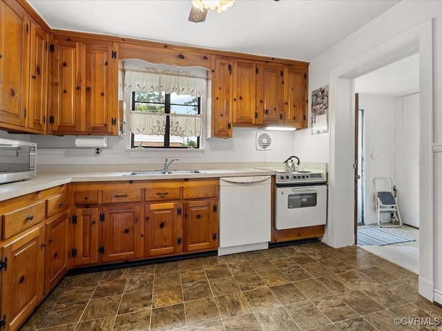 5913 Ridge Rd, Henrico, VA 23227 - kitchen with white appliances, brown cabinets, light countertops, and stone finish floors