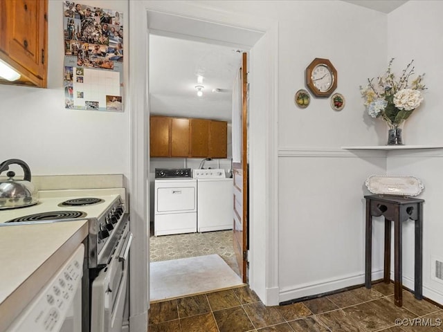 5913 Ridge Rd, Henrico, VA 23227 - kitchen featuring washing machine and dryer, brown cabinets, electric range oven, and light countertops