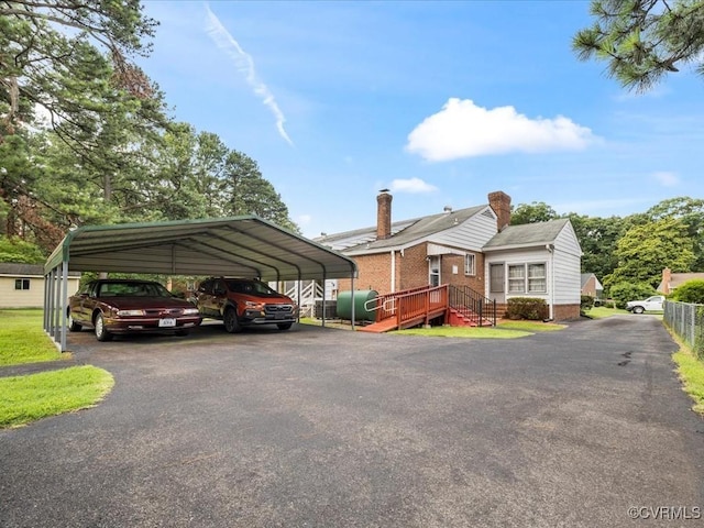 5913 Ridge Rd, Henrico, VA 23227 - view of front facade featuring a detached carport, driveway, and oil tank