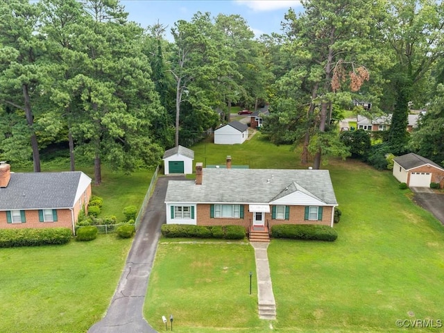 5913 Ridge Rd, Henrico, VA 23227 - view of front of house featuring brick siding, an outbuilding, a detached garage, driveway, and a chimney