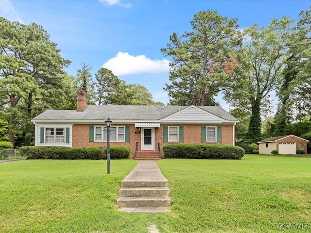 5913 Ridge Rd, Henrico, VA 23227 - view of front facade featuring a front yard, a chimney, and brick siding