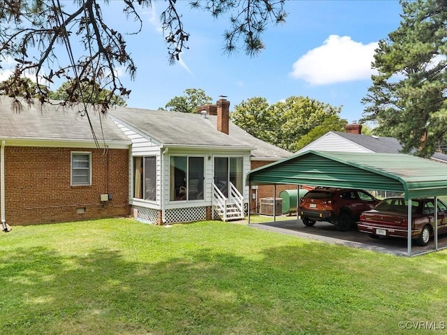 5913 Ridge Rd, Henrico, VA 23227 - back of property with a carport, brick siding, crawl space, a sunroom, and a yard