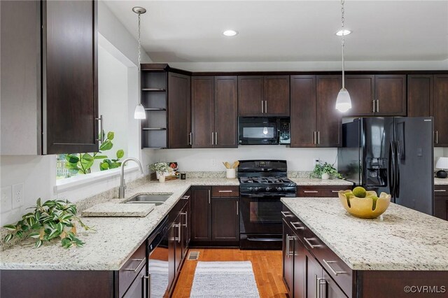 8838 Rushbrooke Ln, Mechanicsville, VA 23116 - kitchen featuring black appliances, open shelves, dark brown cabinets, light wood-type flooring, and recessed lighting