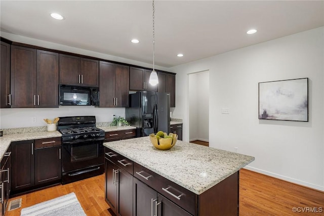 8838 Rushbrooke Ln, Mechanicsville, VA 23116 - kitchen with black appliances, light wood finished floors, dark brown cabinetry, light stone countertops, and recessed lighting