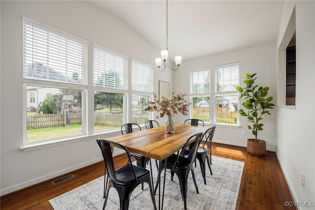8838 Rushbrooke Ln, Mechanicsville, VA 23116 - dining space featuring a chandelier, vaulted ceiling, and wood finished floors