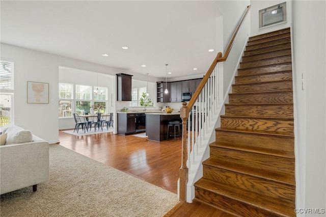 8838 Rushbrooke Ln, Mechanicsville, VA 23116 - stairway featuring healthy amount of natural light, wood finished floors, and recessed lighting