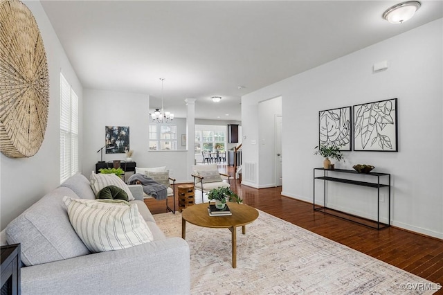 8838 Rushbrooke Ln, Mechanicsville, VA 23116 - living room featuring wood finished floors and a chandelier