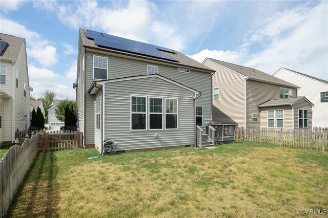 8838 Rushbrooke Ln, Mechanicsville, VA 23116 - rear view of property featuring solar panels, a fenced backyard, a wooden deck, and crawl space