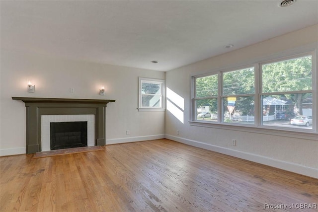 727 Teach St, Hampton, VA 23661 - unfurnished living room with wood finished floors and a brick fireplace