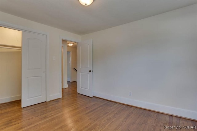 727 Teach St, Hampton, VA 23661 - unfurnished bedroom featuring light wood-style flooring and a closet
