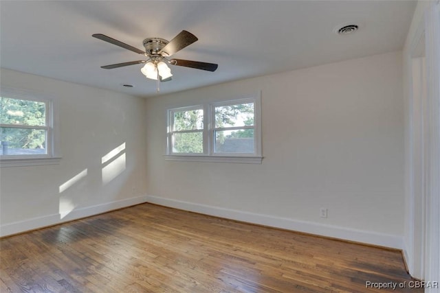727 Teach St, Hampton, VA 23661 - spare room featuring healthy amount of natural light, wood finished floors, and a ceiling fan