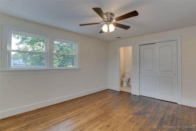 727 Teach St, Hampton, VA 23661 - unfurnished bedroom featuring wood finished floors, a closet, ceiling fan, and connected bathroom