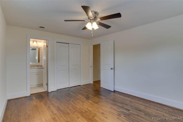 727 Teach St, Hampton, VA 23661 - unfurnished bedroom featuring wood finished floors, a closet, ensuite bath, and ceiling fan