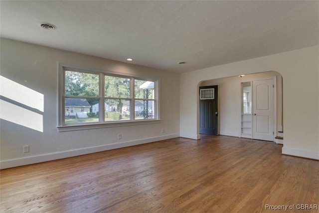 727 Teach St, Hampton, VA 23661 - unfurnished room featuring arched walkways, wood finished floors, and recessed lighting