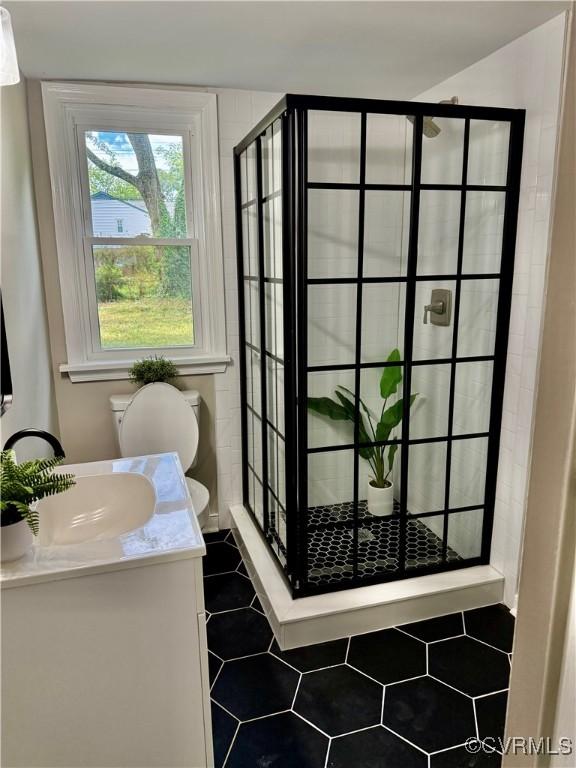 8409 Zell Ln, Henrico, VA 23229 - full bath with a stall shower, vanity, and tile patterned flooring