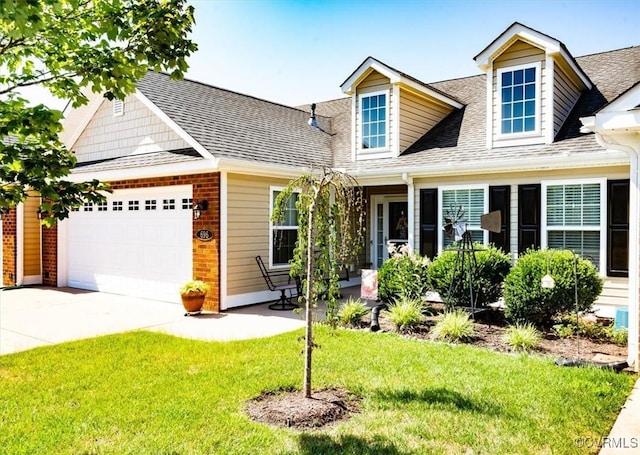 696 Anne Ln, Aylett, VA 23009 - cape cod-style house with driveway, a front yard, roof with shingles, an attached garage, and brick siding
