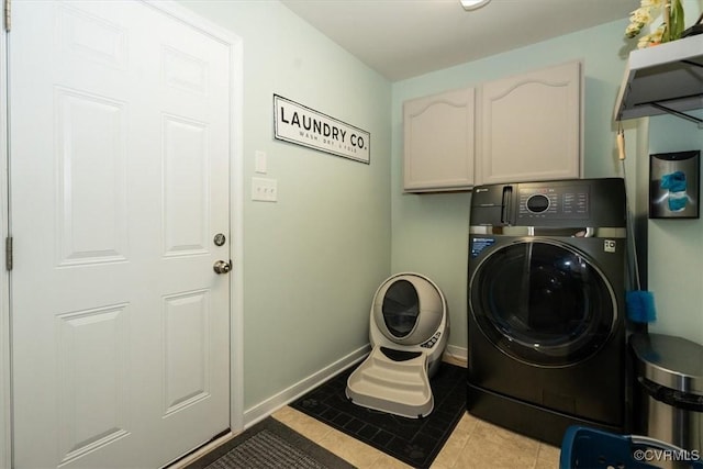 696 Anne Ln, Aylett, VA 23009 - washroom featuring washer / clothes dryer, cabinet space, and light tile patterned floors