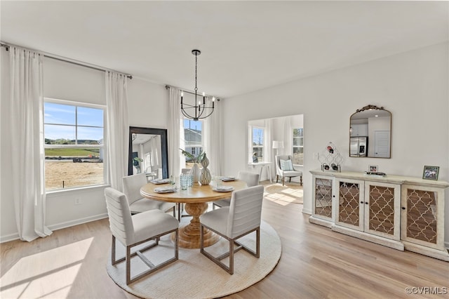 3417 Marwick Pl, Richmond, VA 23234 - dining room featuring a chandelier, healthy amount of natural light, and light wood finished floors