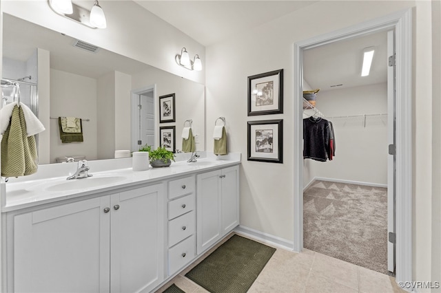 3417 Marwick Pl, Richmond, VA 23234 - bathroom featuring double vanity, a spacious closet, and tile patterned flooring