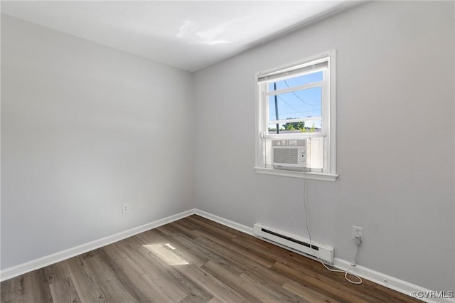 1110 Pine Ave, Hopewell, VA 23860 - spare room featuring baseboard heating, wood finished floors, and cooling unit