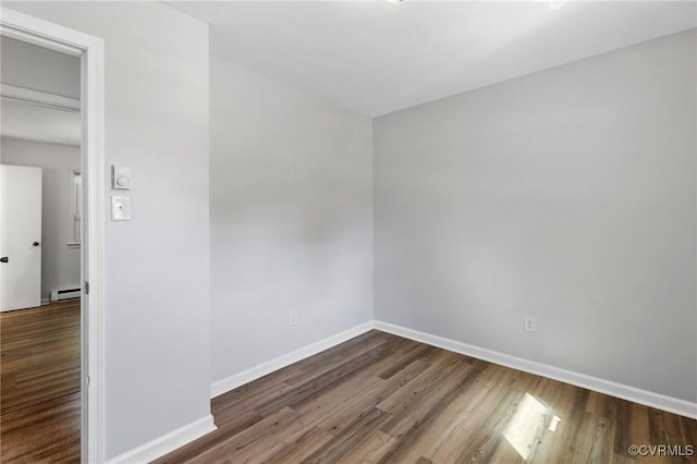 1110 Pine Ave, Hopewell, VA 23860 - empty room featuring dark wood finished floors and a baseboard heating unit