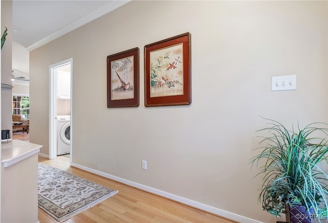 138 Carriage Point Ln, Glen Allen, VA 23059 - corridor featuring crown molding, washer / dryer, and light wood-style flooring