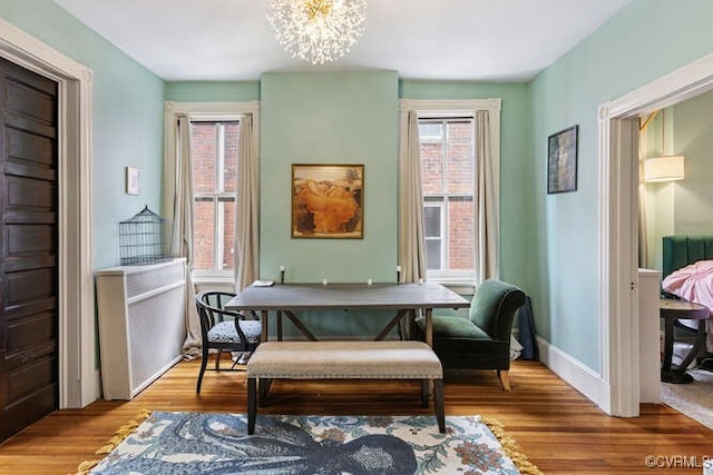 2024 Park Ave, Richmond, VA 23220 - living area featuring wood finished floors and a chandelier