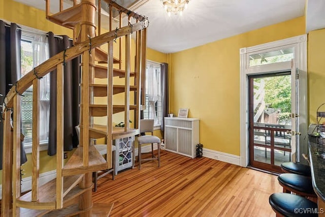 2024 Park Ave, Richmond, VA 23220 - interior space with wood finished floors and a chandelier