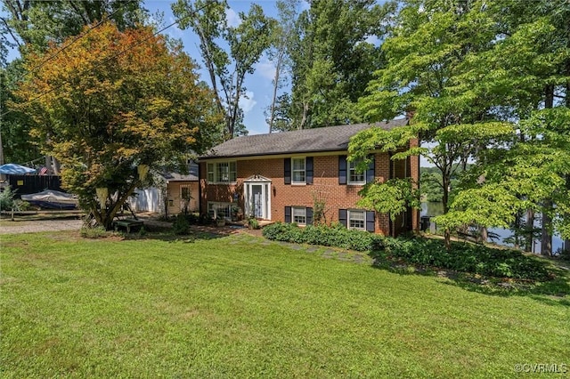 2226 Highland Dr, Powhatan, VA 23139 - bi-level home with brick siding, a front lawn, and a chimney