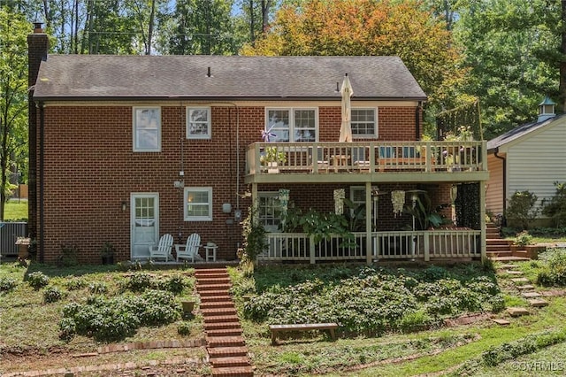 2226 Highland Dr, Powhatan, VA 23139 - view of front of property with stairway, a chimney, brick siding, and a deck