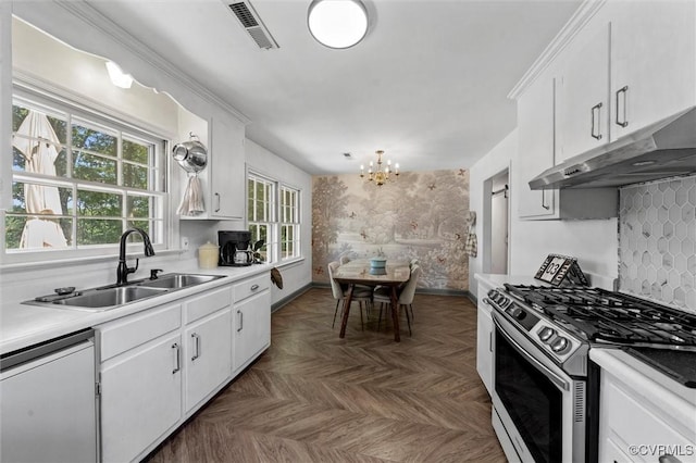 2226 Highland Dr, Powhatan, VA 23139 - kitchen with gas stove, dishwasher, under cabinet range hood, a chandelier, and white cabinetry