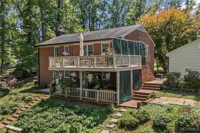 2226 Highland Dr, Powhatan, VA 23139 - view of front of property featuring a deck, brick siding, and a chimney