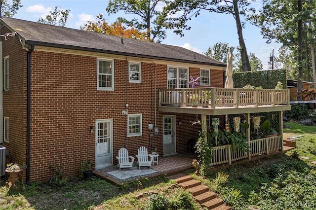 2226 Highland Dr, Powhatan, VA 23139 - back of property with brick siding, a deck, and a patio area