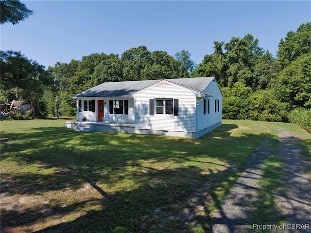 366 Patterson Rd, Mattaponi, VA 23110 - view of front of home with covered porch, a front lawn, and a view of trees