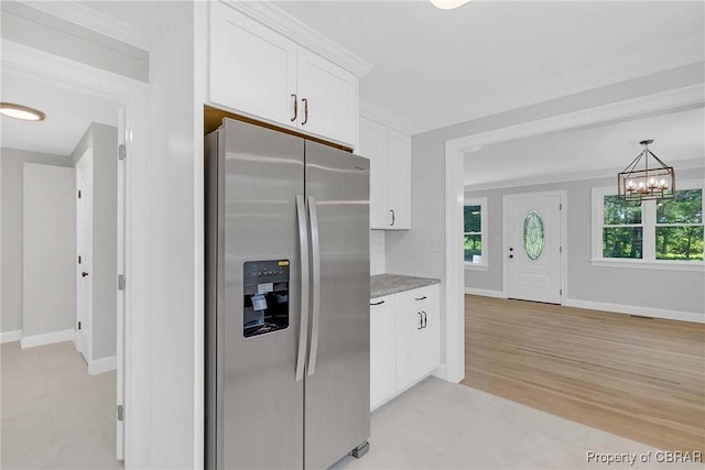 366 Patterson Rd, Mattaponi, VA 23110 - kitchen featuring stainless steel fridge, white cabinets, a chandelier, light stone counters, and pendant lighting
