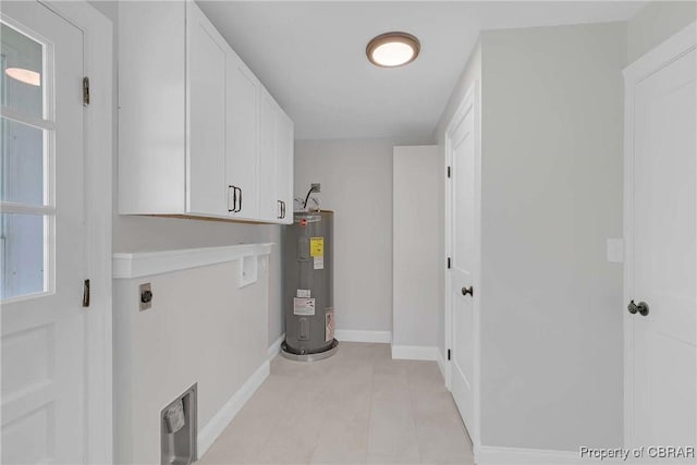 366 Patterson Rd, Mattaponi, VA 23110 - laundry area featuring electric water heater, electric dryer hookup, cabinet space, and light tile patterned floors