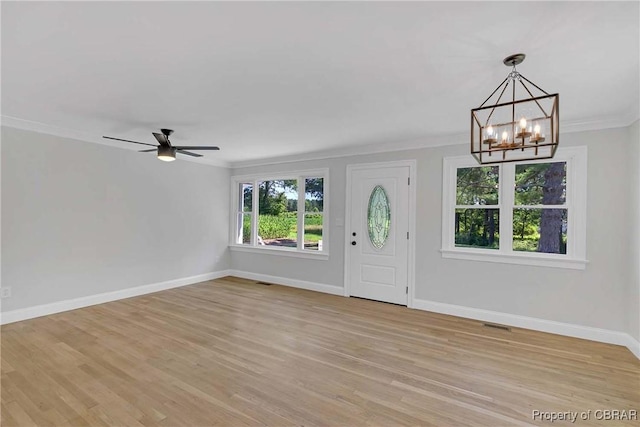 366 Patterson Rd, Mattaponi, VA 23110 - entrance foyer featuring a chandelier, ornamental molding, light wood-style flooring, and a ceiling fan