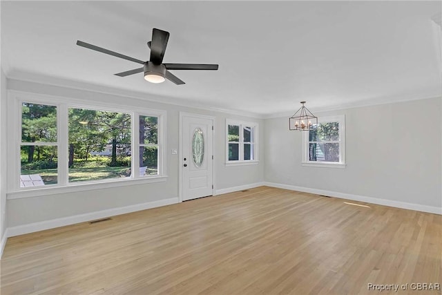 366 Patterson Rd, Mattaponi, VA 23110 - foyer featuring a chandelier, light wood-type flooring, crown molding, and a ceiling fan