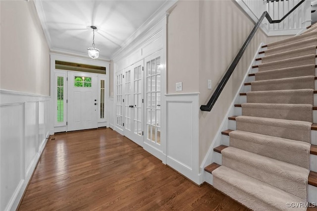 11499 Jack Ln, Hanover, VA 23146 - entrance foyer featuring a decorative wall, stairway, wood finished floors, crown molding, and a wainscoted wall