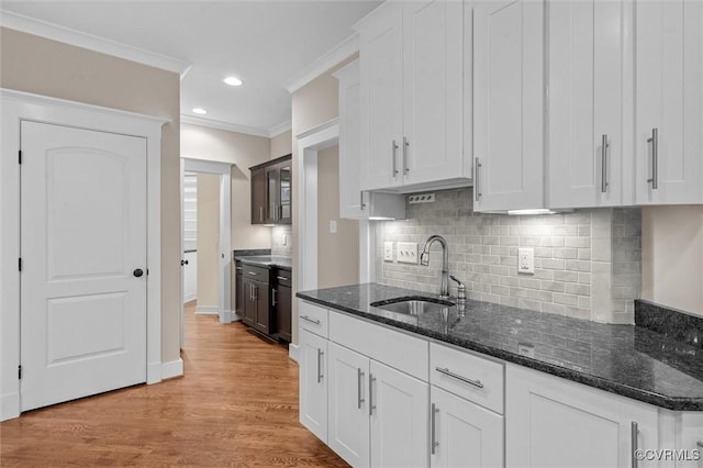 11499 Jack Ln, Hanover, VA 23146 - kitchen featuring white cabinets, decorative backsplash, dark stone countertops, recessed lighting, and crown molding