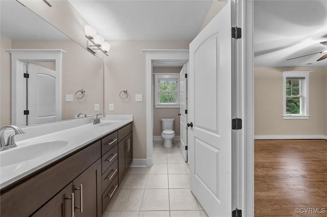 11499 Jack Ln, Hanover, VA 23146 - full bath featuring double vanity, healthy amount of natural light, a ceiling fan, and tile patterned flooring