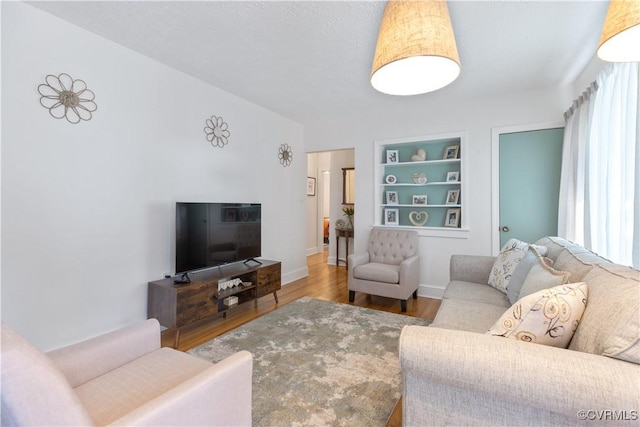 415 Crescent Ave, Colonial Heights, VA 23834 - living room featuring wood finished floors and built in shelves