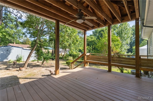 415 Crescent Ave, Colonial Heights, VA 23834 - wooden terrace featuring ceiling fan, a fenced backyard, an outdoor structure, and view of wooded area