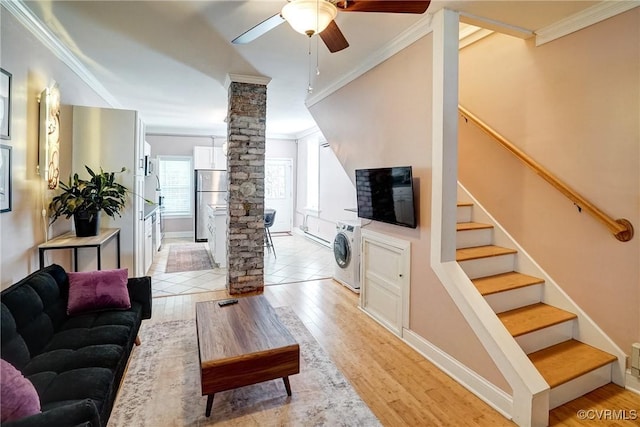1410 W Clay St, Richmond, VA 23220 - living room with ornate columns, washer / dryer, crown molding, a ceiling fan, and stairway