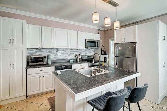 1410 W Clay St, Richmond, VA 23220 - kitchen with stainless steel appliances, dark countertops, light tile patterned floors, a breakfast bar, and ornamental molding